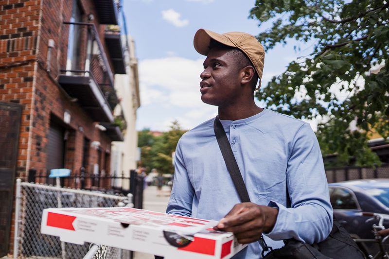 Satisfied Pizza factory delivery customer