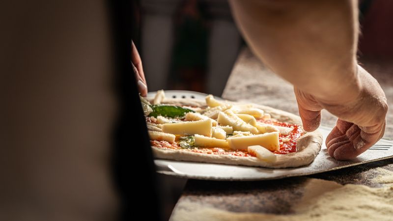 Pizza factory kitchen where our team crafts every pizza with passion